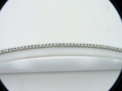 Close up 4 prong diamond tennis bracelet