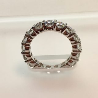 Solid sided eternity band with diamonds