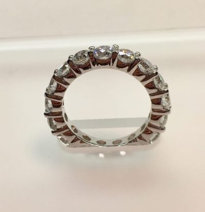 Solid sided eternity band with diamonds