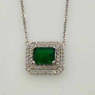 White gold pendant with emerald